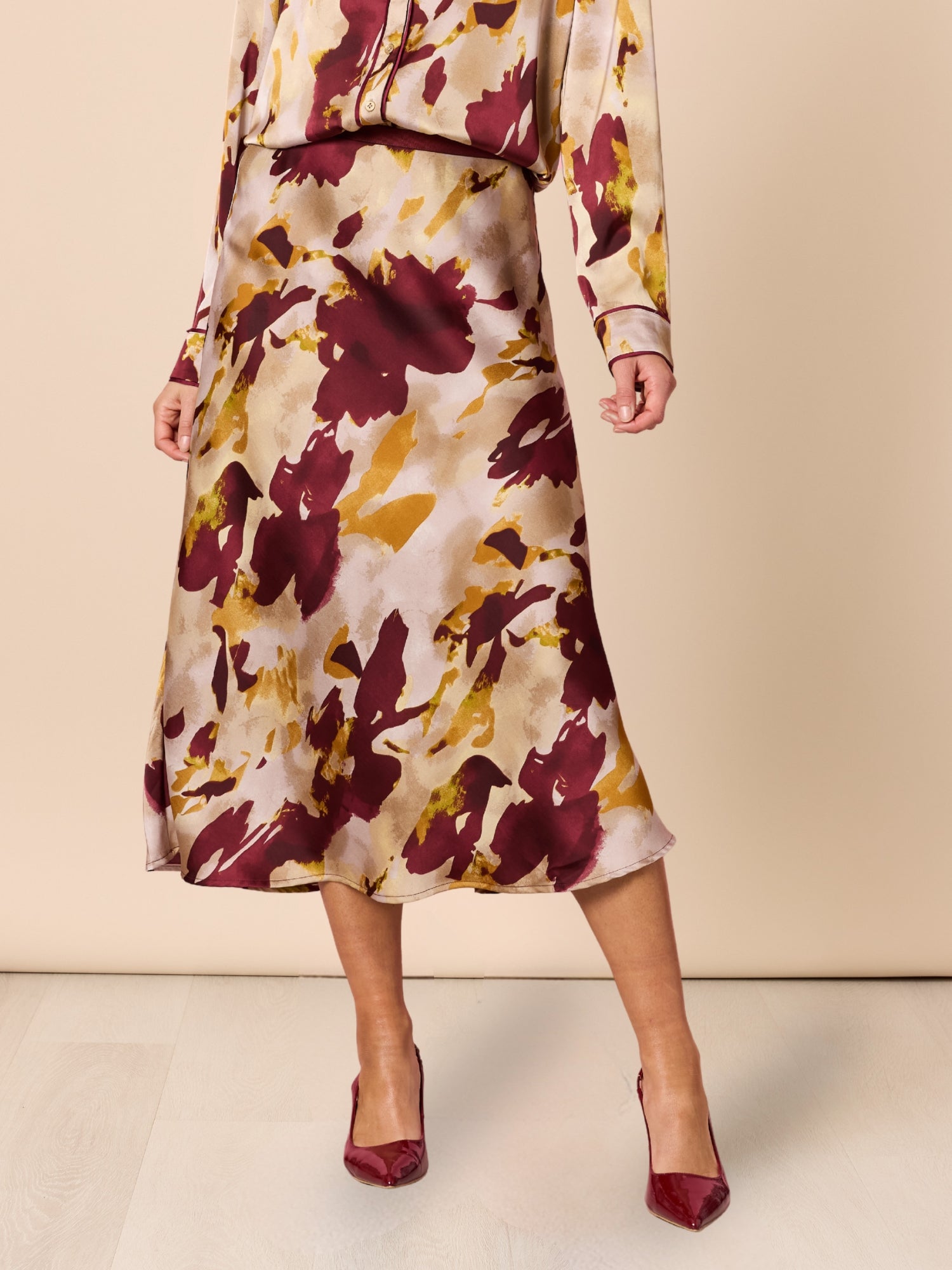 Image of a model wearing Skirts. Product name - Verona Print Skirt Shiraz Multi in Shiraz Multi colour by brand - Hammock & Vine