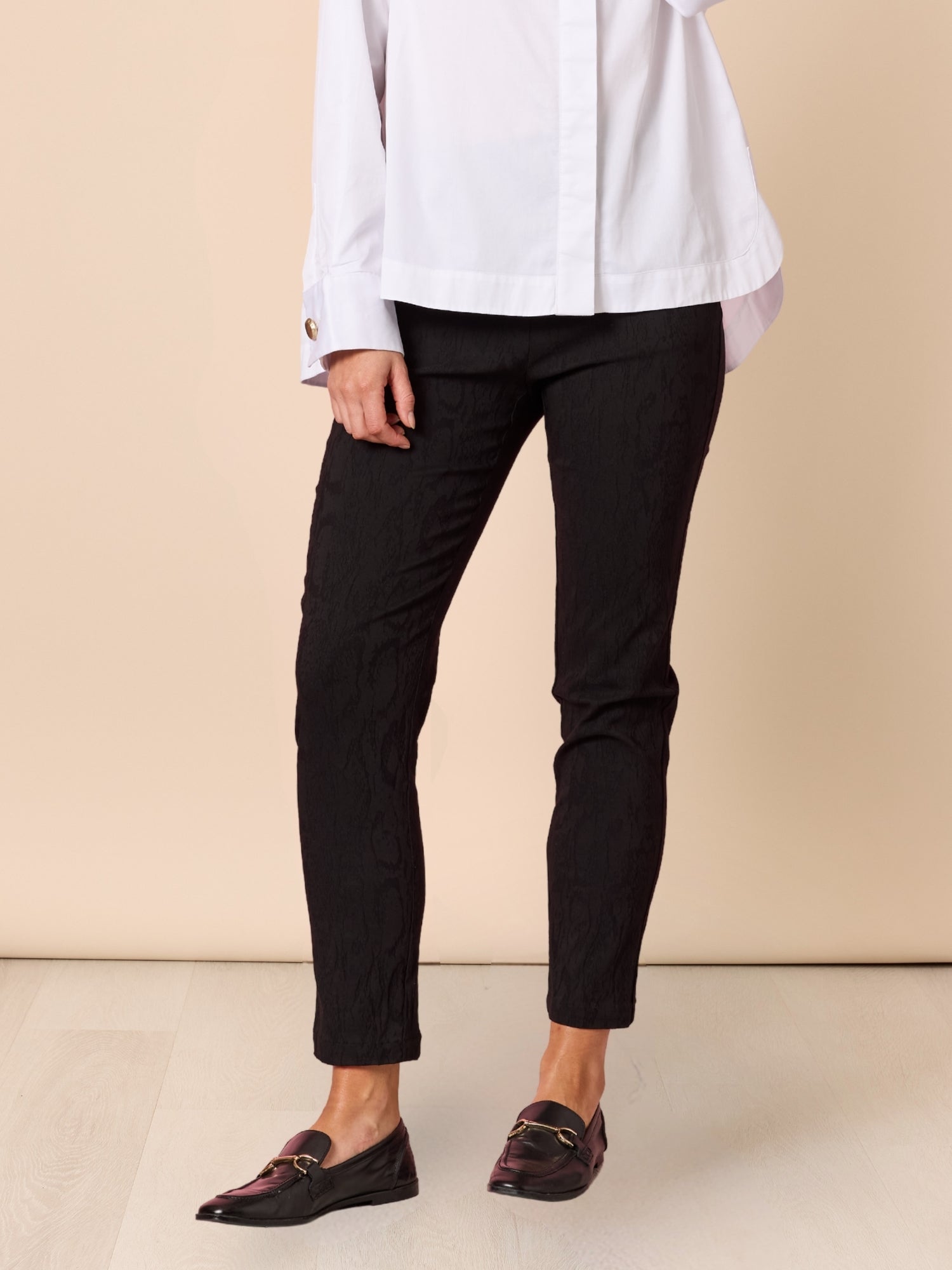 Image of a model wearing Pants. Product name - Mila Pant Black in Black colour by brand - Hammock & Vine