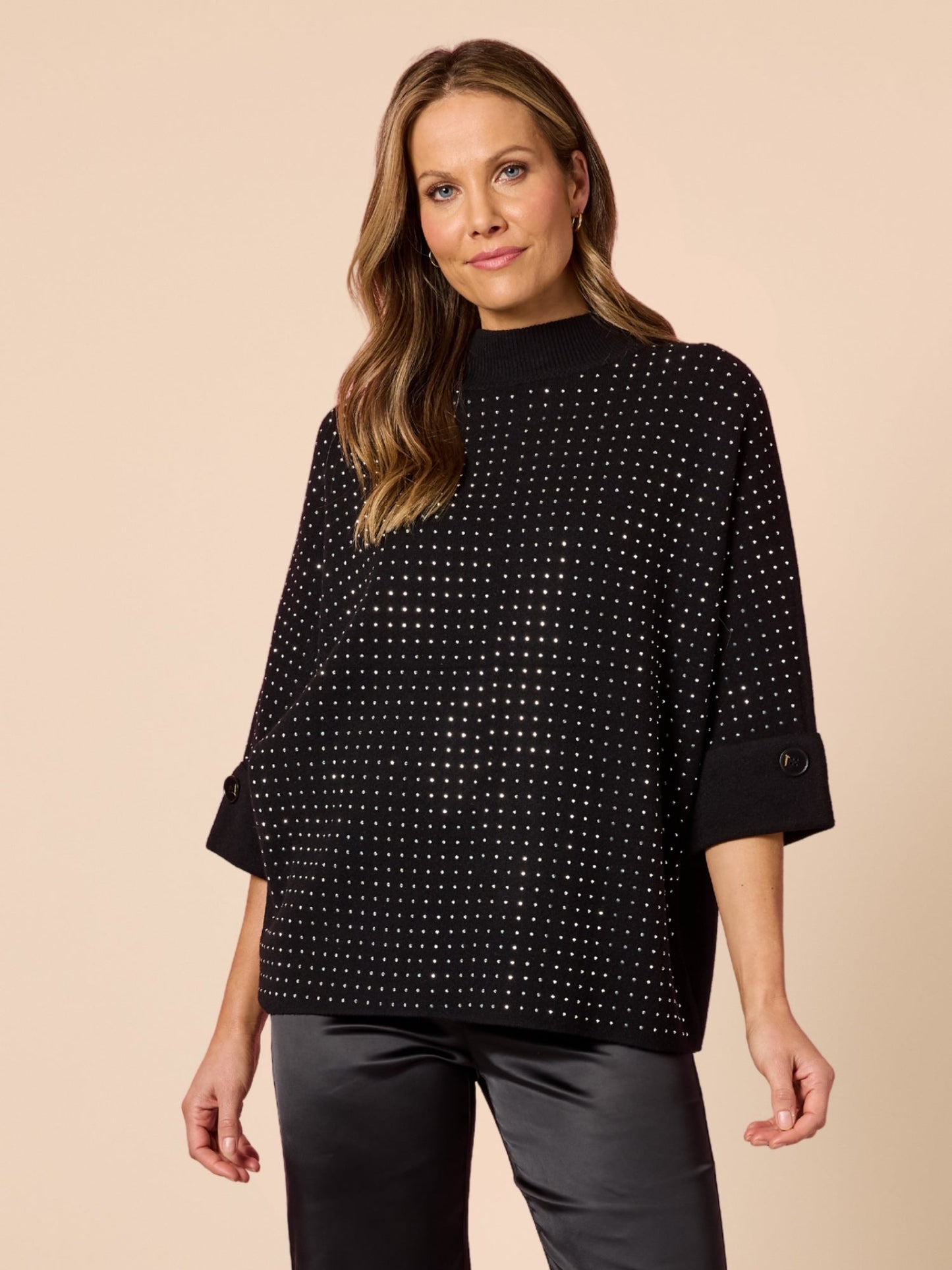 Image of a model wearing Tops. Product name - Luce Jumper Black in Black colour by brand - Hammock & Vine