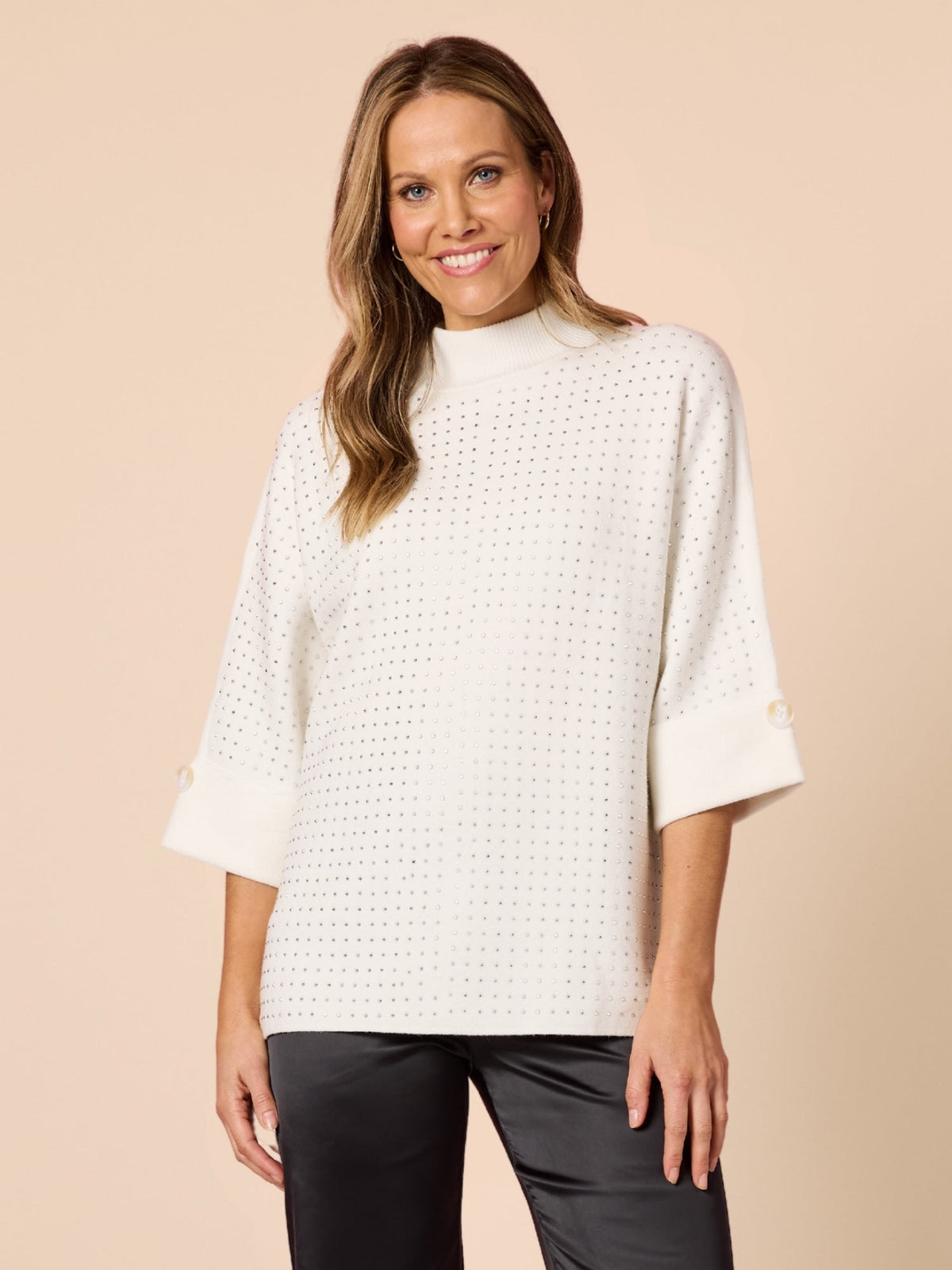 Image of a model wearing Tops. Product name - Luce Jumper Ivory in Ivory colour by brand - Hammock & Vine