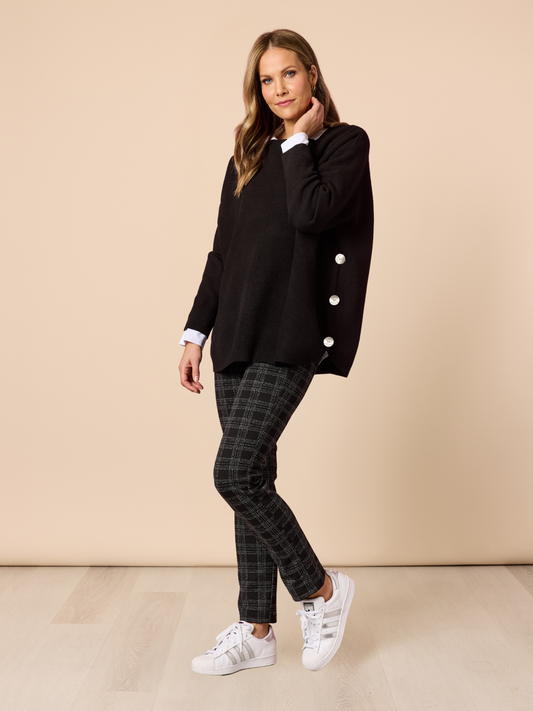 Image of a model wearing Tops. Product name - Rochelle Knit Black in Black colour by brand - Clarity