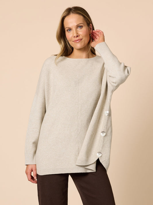 Image of a model wearing Tops. Product name - Rochelle Knit Natural in Natural colour by brand - Clarity