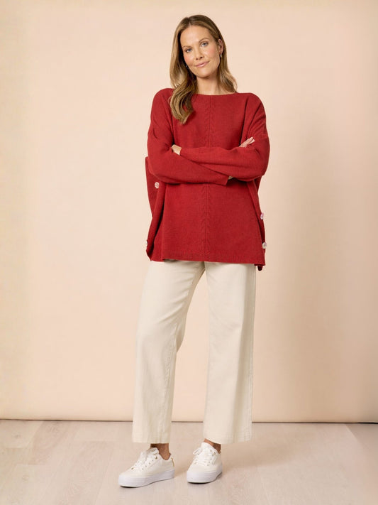 Image of a model wearing Tops. Product name - Rochelle Knit Paprika in Paprika colour by brand - Clarity