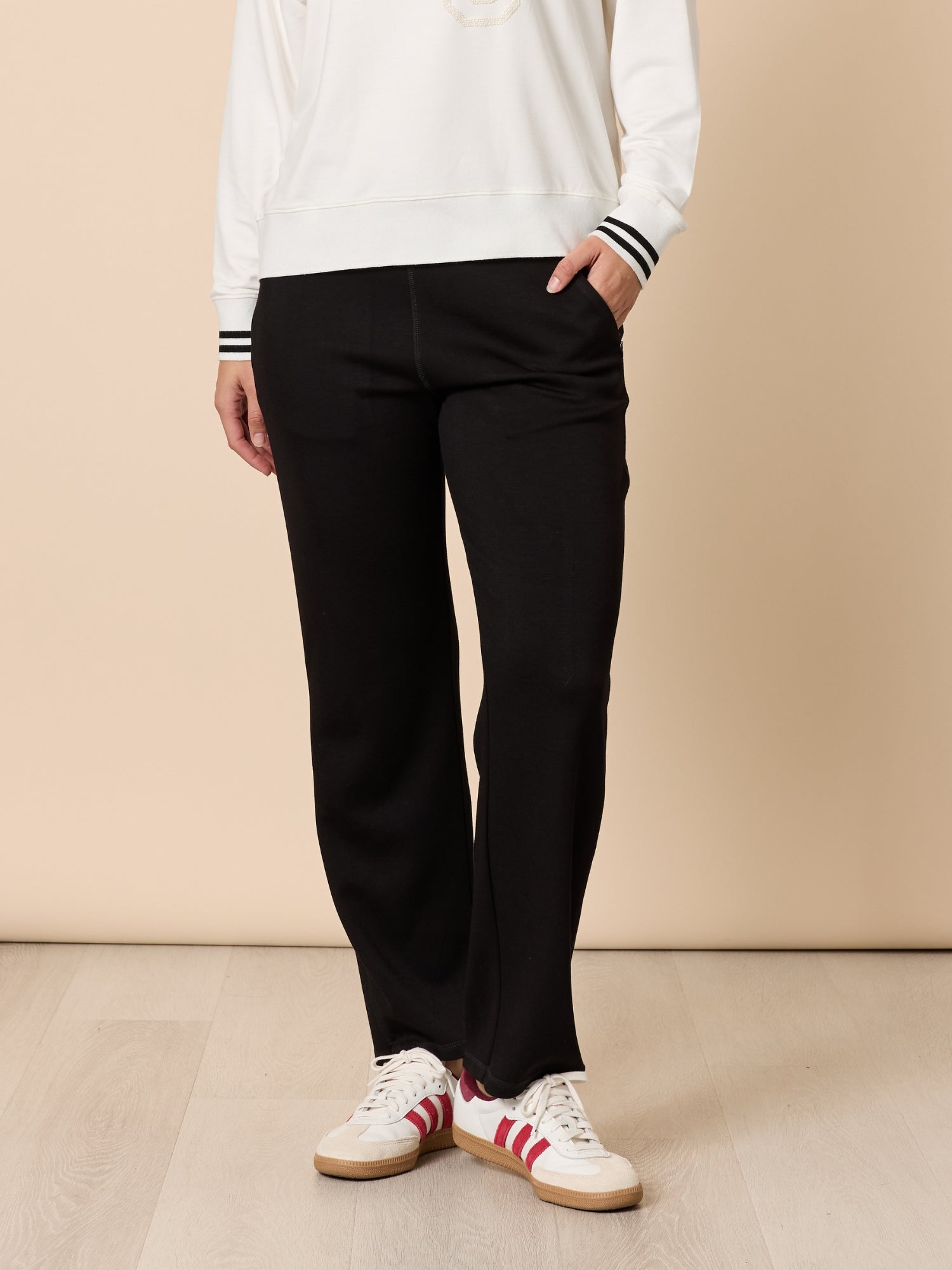 Image of a model wearing Pants. Product name - Urban City Pant Black in Black colour by brand - Threadz