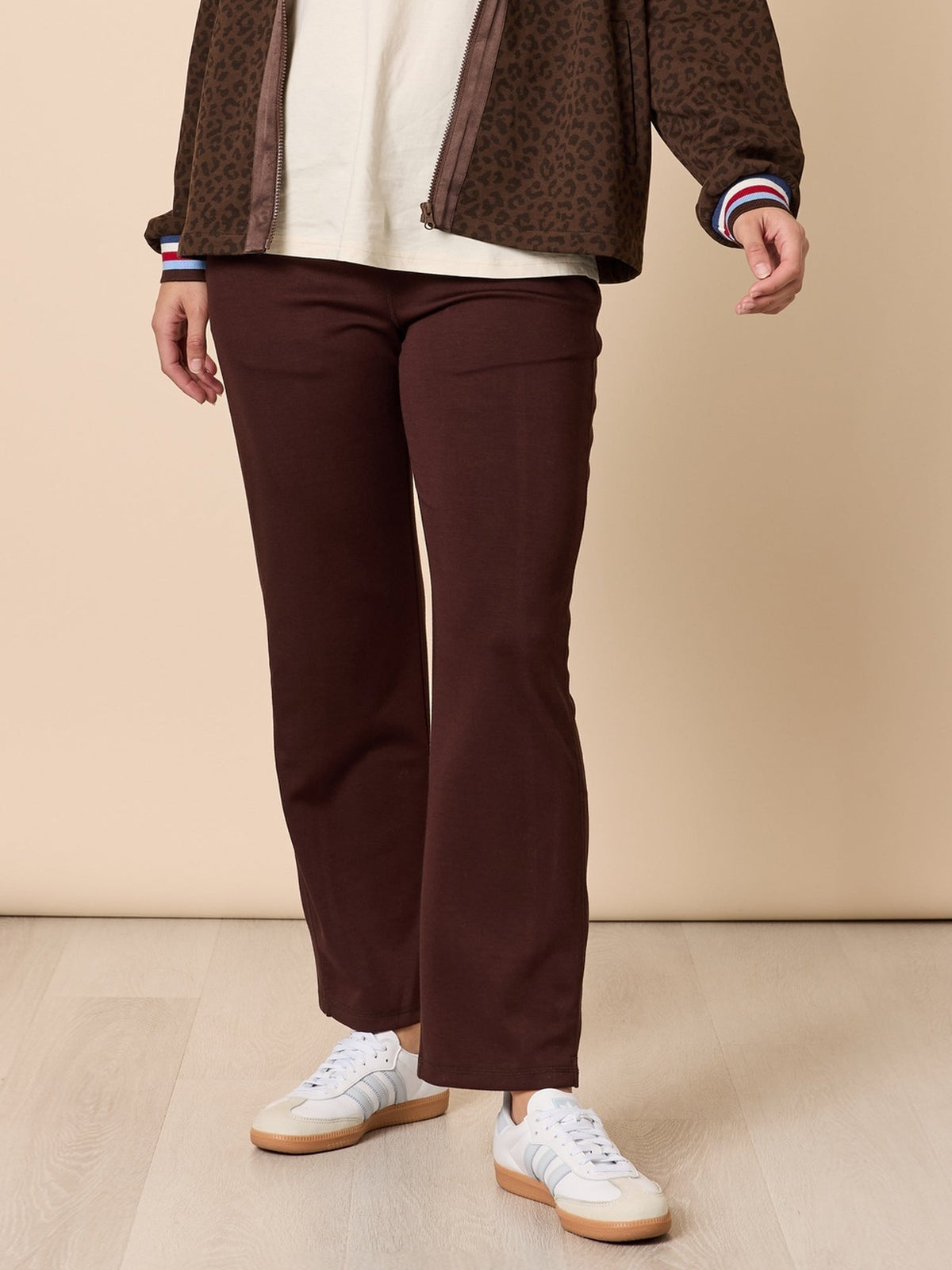Image of a model wearing Pants. Product name - Urban City Pant Coffee in Coffee colour by brand - Threadz