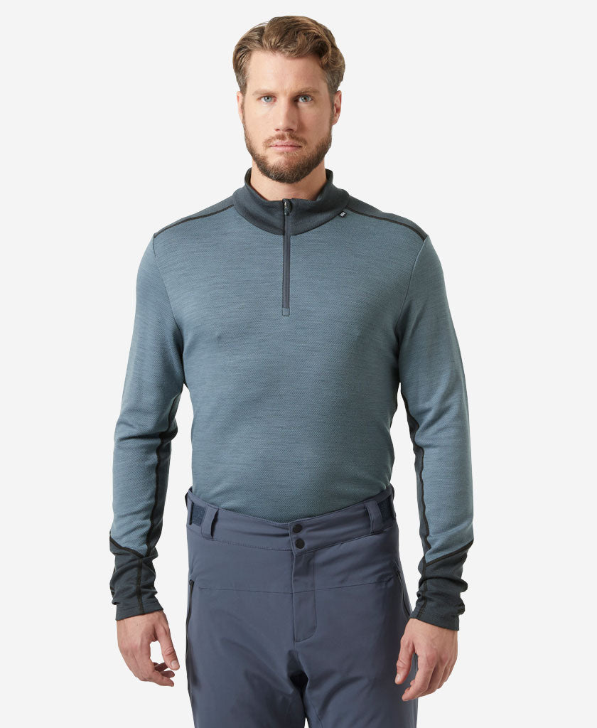 Image of a model wearing Tops. Product name - LIFA MERINO MIDWEIGHT 1/2 ZIP, Washed Navy in Washed Navy colour by brand - Helly Hansen