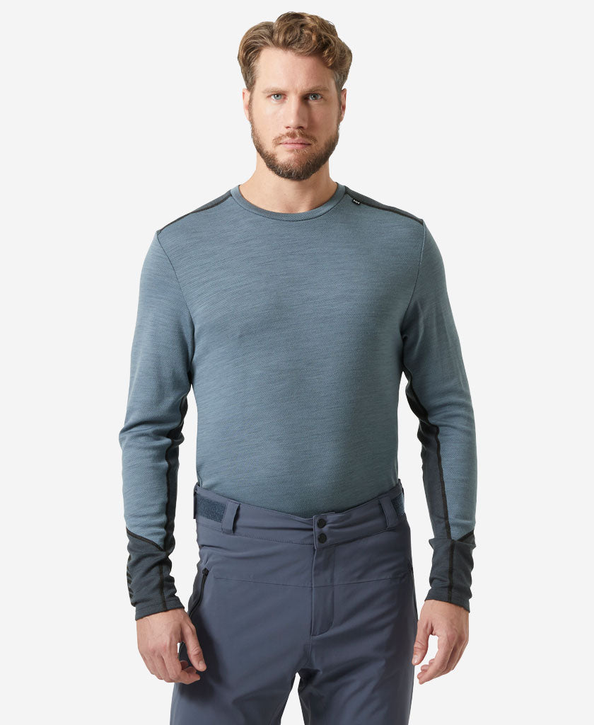 Image of a model wearing Tops. Product name - LIFA MERINO MIDWEIGHT CREW, Washed Navy in Washed Navy colour by brand - Helly Hansen