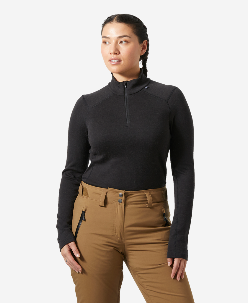 Image of a model wearing Tops. Product name - W LIFA MERINO MIDWEIGHT 1/2 ZIP, Black in Black colour by brand - Helly Hansen