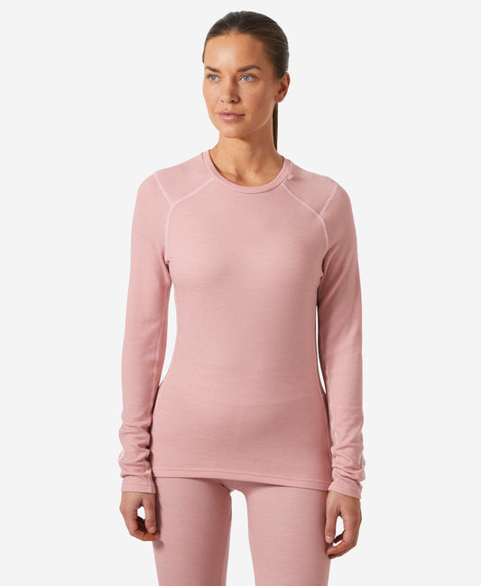 Image of a model wearing Tops. Product name - W LIFA MERINO MIDWEIGHT CREW, Pink Salt in Pink Salt colour by brand - Helly Hansen