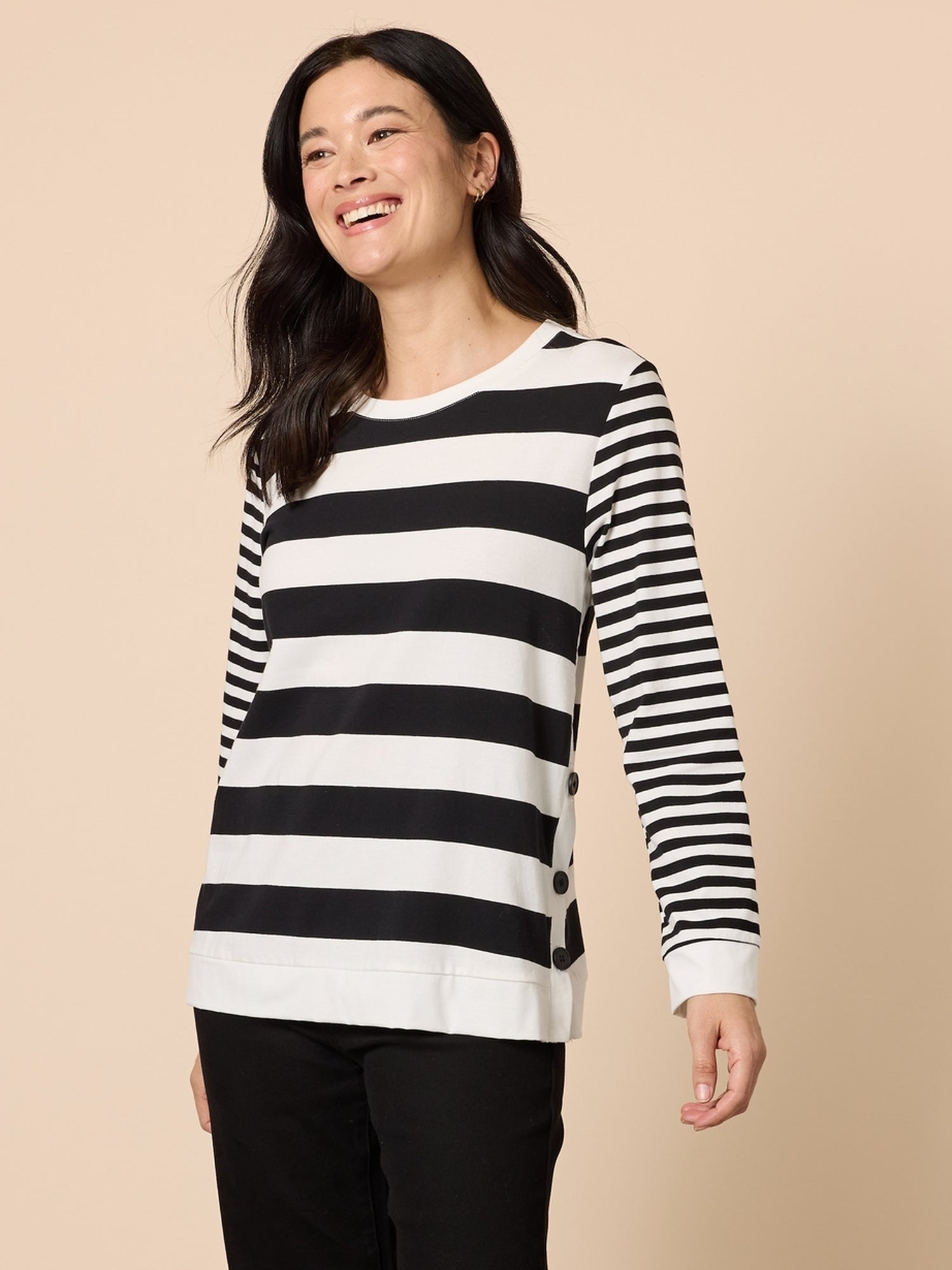 Image of a model wearing Tops. Product name - Brighton Stripe Top Black/Ivory in Black/Ivory colour by brand - Gordon Smith