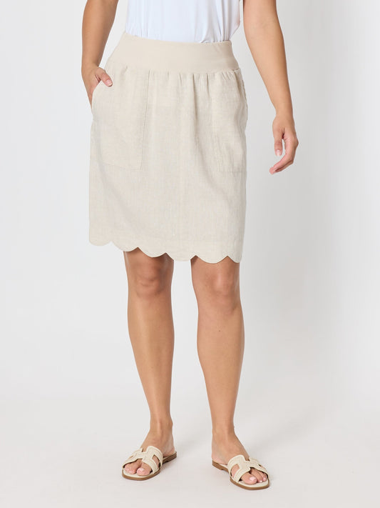 Image of a model wearing Skirts. Product name - Shelley Scallop Hem Linen Skirt Natural in Natural colour by brand - Gordon Smith
