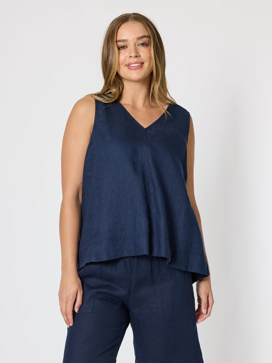 Image of a model wearing Tops. Product name - Tilly Linen Camisole Navy in Navy colour by brand - Gordon Smith
