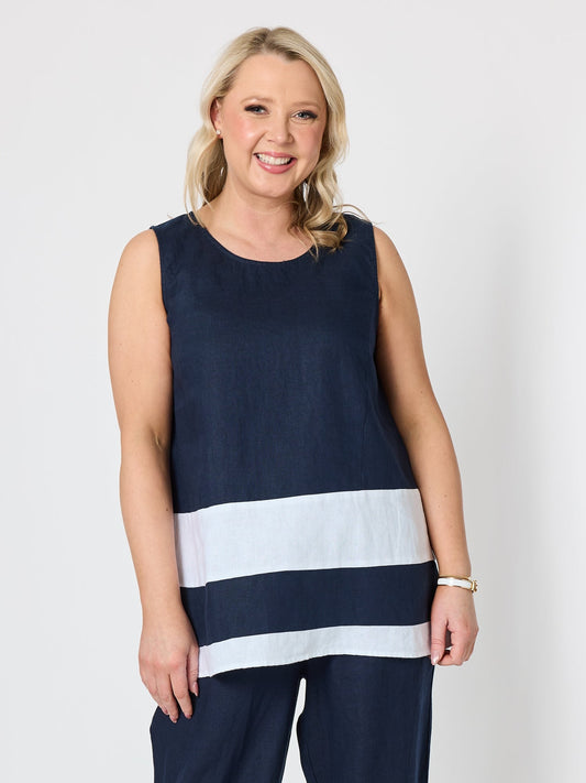 Image of a model wearing Tops. Product name - Chloe Contrast Linen Top Navy/White in Navy/White colour by brand - Gordon Smith