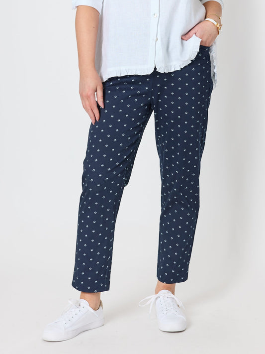 Image of a model wearing Pants. Product name - Tropez Slim Leg Print Pant Navy/White in Navy/White colour by brand - Gordon Smith
