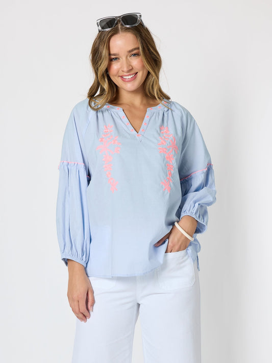Image of a model wearing Tops. Product name - Coral Coast Embroidered Top Pale Blue in Pale Blue colour by brand - Threadz