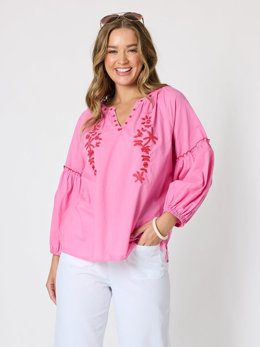 Image of a model wearing Tops. Product name - Coral Coast Embroidered Top Rose in Rose colour by brand - Threadz
