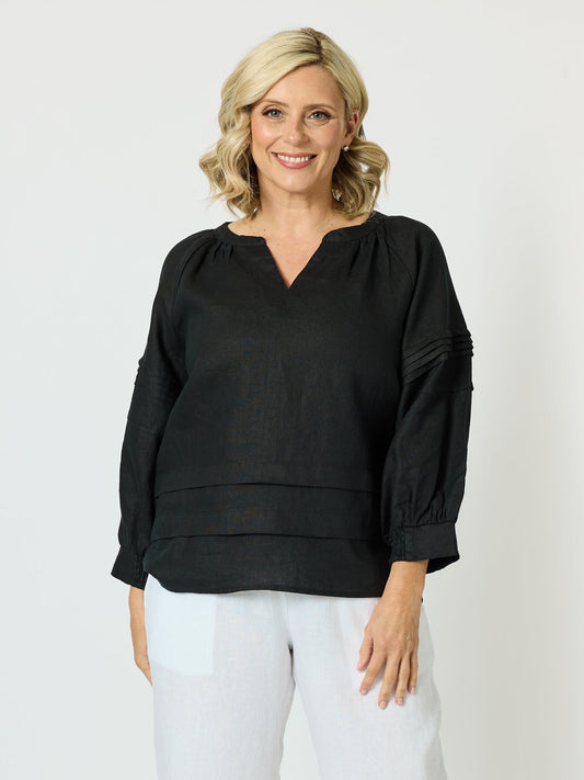 Image of a model wearing Tops. Product name - Kate Linen Top Black in Black colour by brand - Gordon Smith
