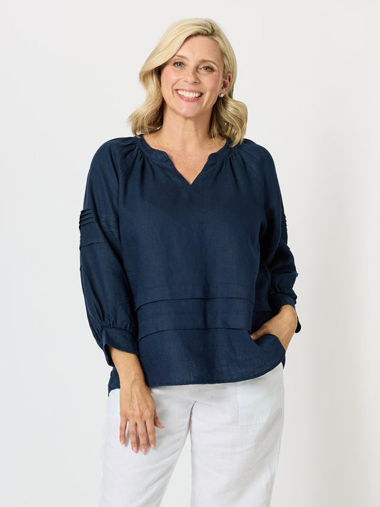 Image of a model wearing Tops. Product name - Kate Linen Top Navy in Navy colour by brand - Gordon Smith