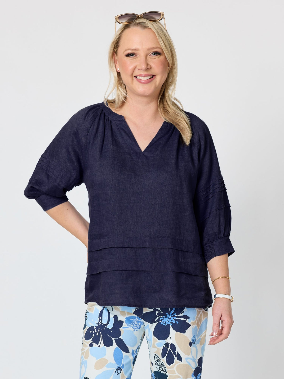 Image of a model wearing Tops. Product name - Kate Linen Top Navy in Navy colour by brand - Gordon Smith
