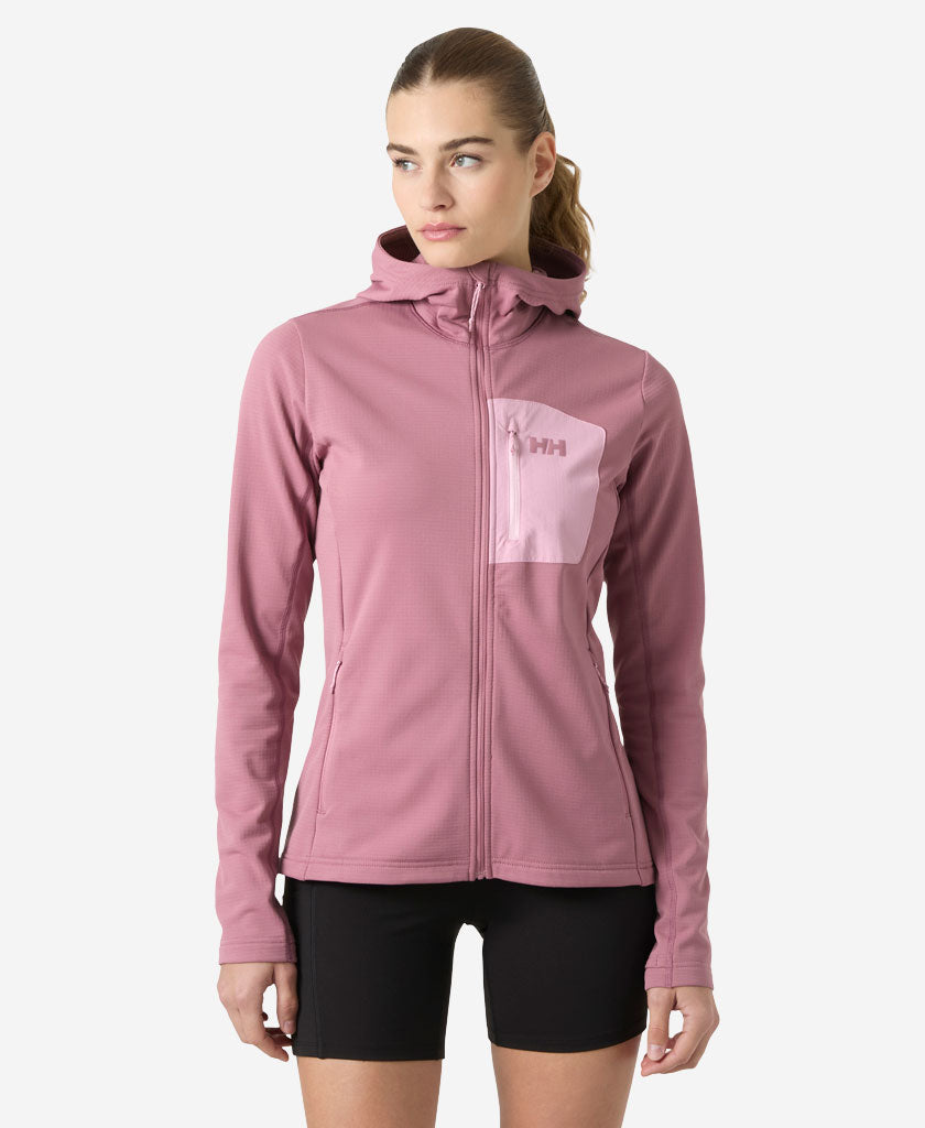 Image of a model wearing Outerwear. Product name - W VERSALITE HOODED JACKET, Wildberry in Wildberry colour by brand - Helly Hansen