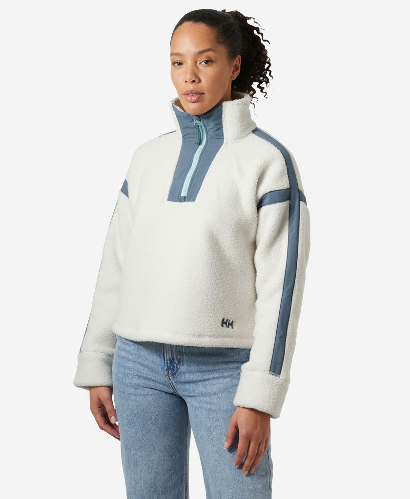 Image of a model wearing Outerwear. Product name - W IMPERIAL PILE ZIP PULLOVER, Snow in Snow colour by brand - Helly Hansen