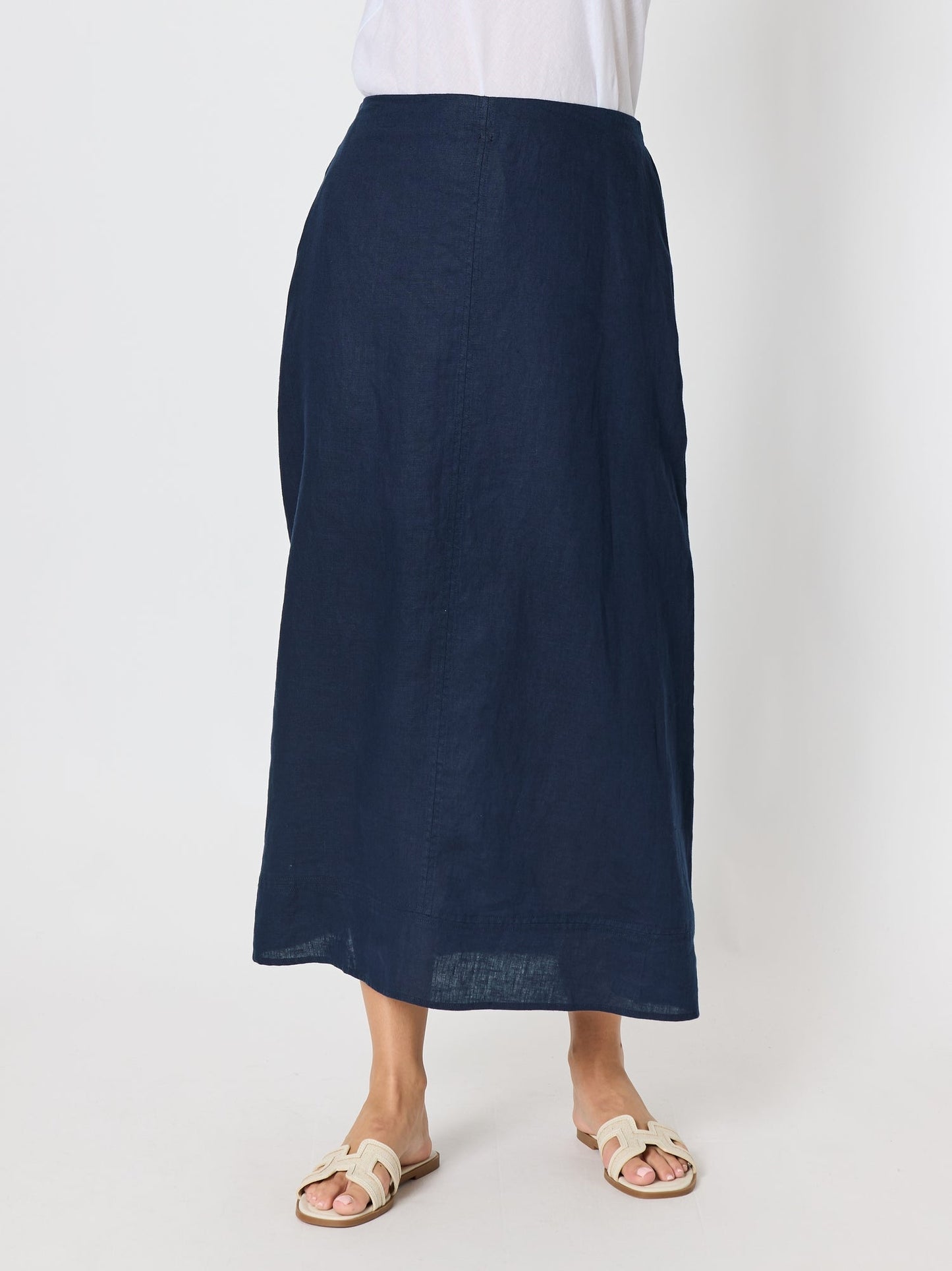 Image of a model wearing Skirts. Product name - Amy Linen Maxi Skirt Navy in Navy colour by brand - Gordon Smith