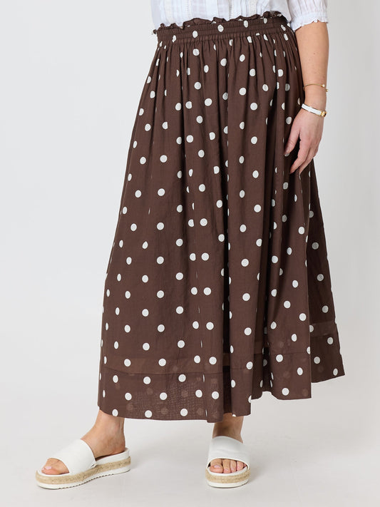 Image of a model wearing Skirts. Product name - Riviera Cotton Spot Maxi Skirt Coffee White in Coffee White colour by brand - Gordon Smith
