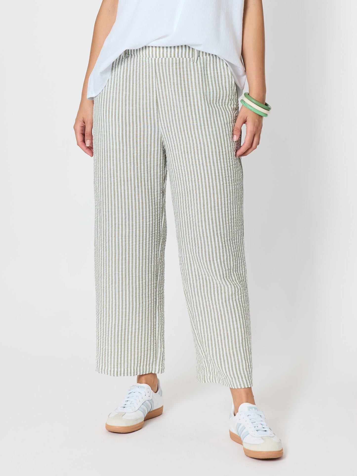 Image of a model wearing Pants. Product name - Urban Stripe Print Pant Olive White in Olive White colour by brand - Threadz