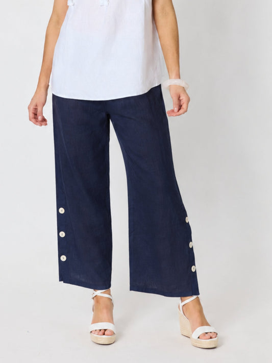 Image of a model wearing Pants. Product name - Bayview Wide Leg Linen Pant Navy in Navy colour by brand - Hammock & Vine