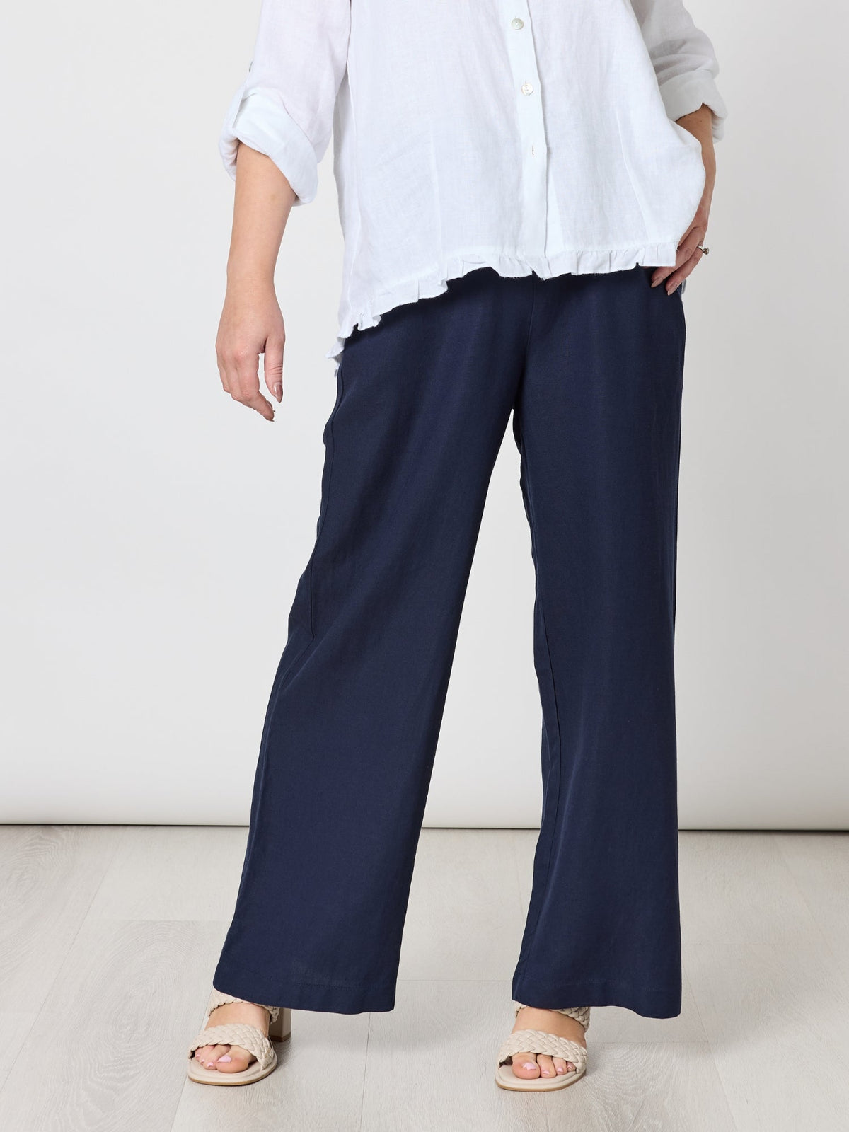Image of a model wearing Pants. Product name - Luella Wide Leg Linen Pant Navy in Navy colour by brand - Gordon Smith