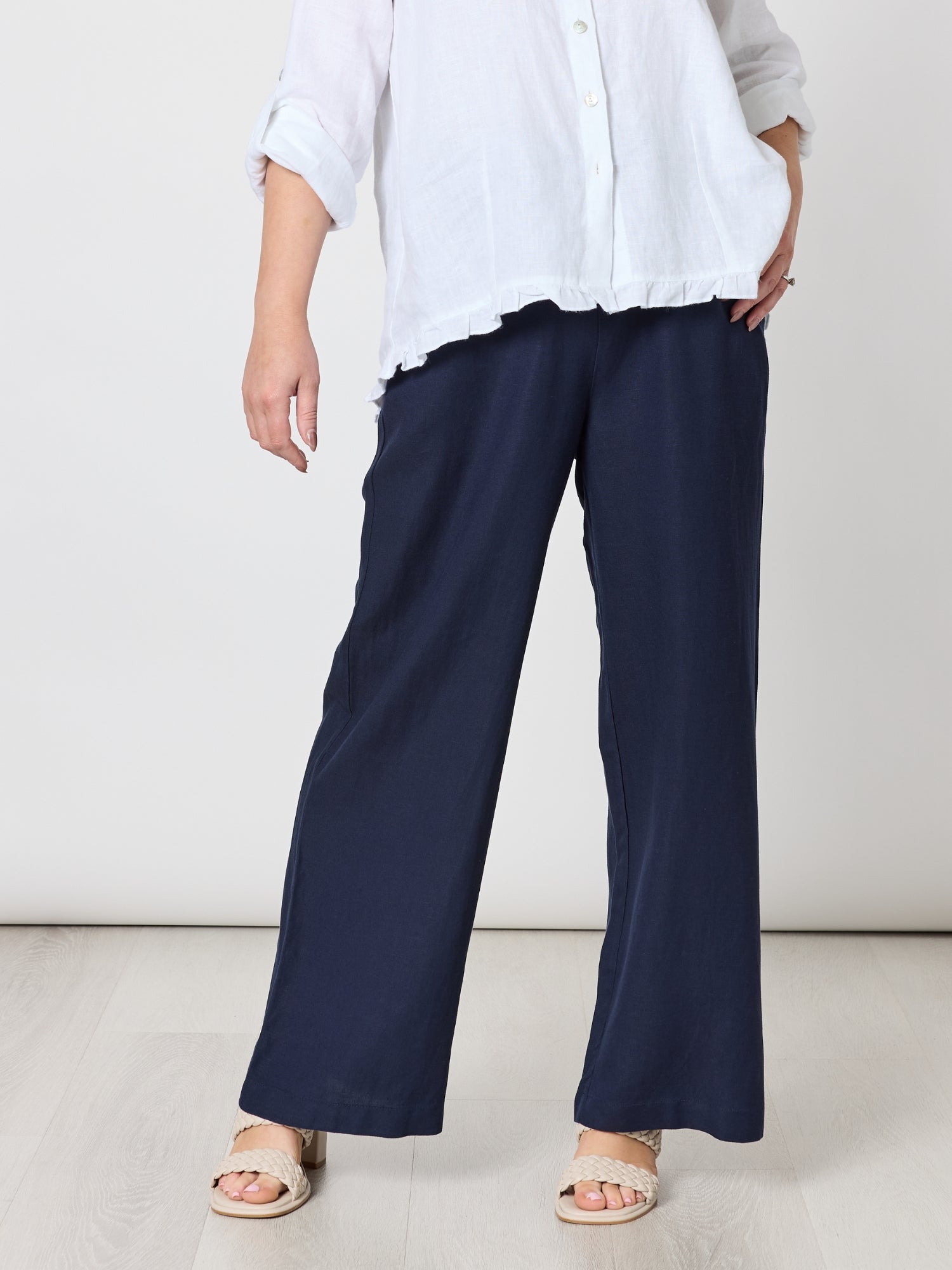 Image of a model wearing Pants. Product name - Luella Wide Leg Linen Pant Navy in Navy colour by brand - Gordon Smith