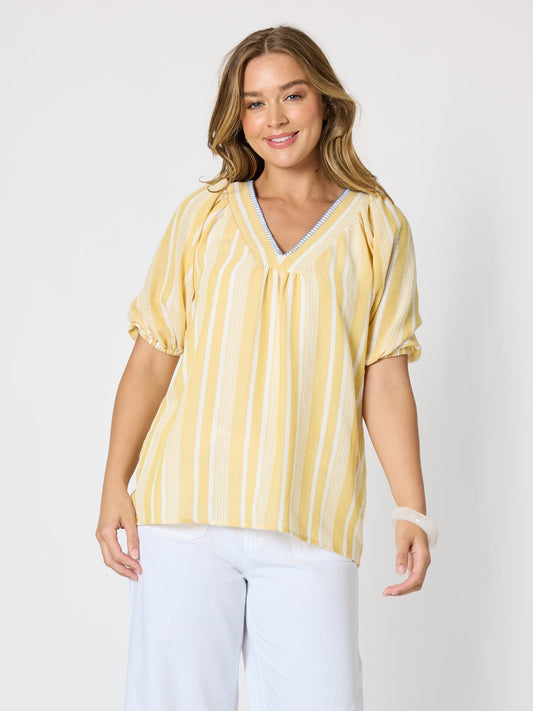 Image of a model wearing Tops. Product name - Seaport Stripe Print V Neck Top Lemon White in Lemon White colour by brand - Threadz