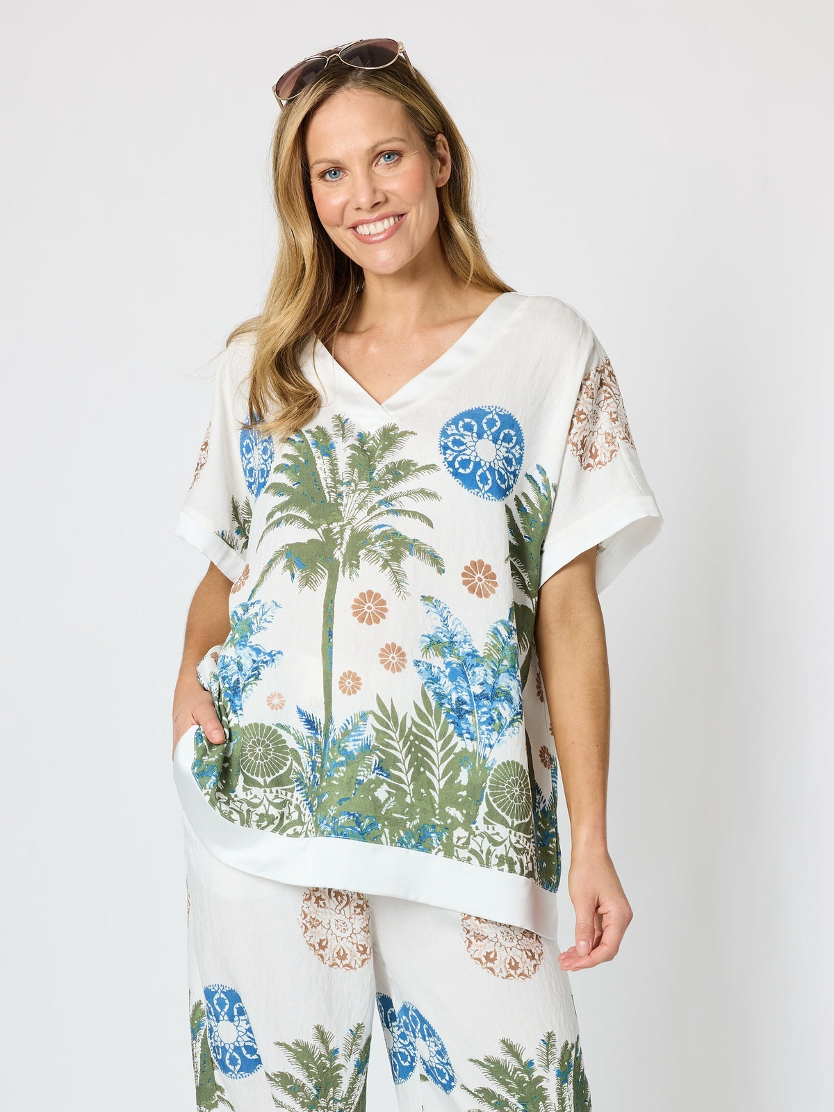 Image of a model wearing Tops. Product name - Escape Print Top Fern Multi in Fern Multi colour by brand - Clarity