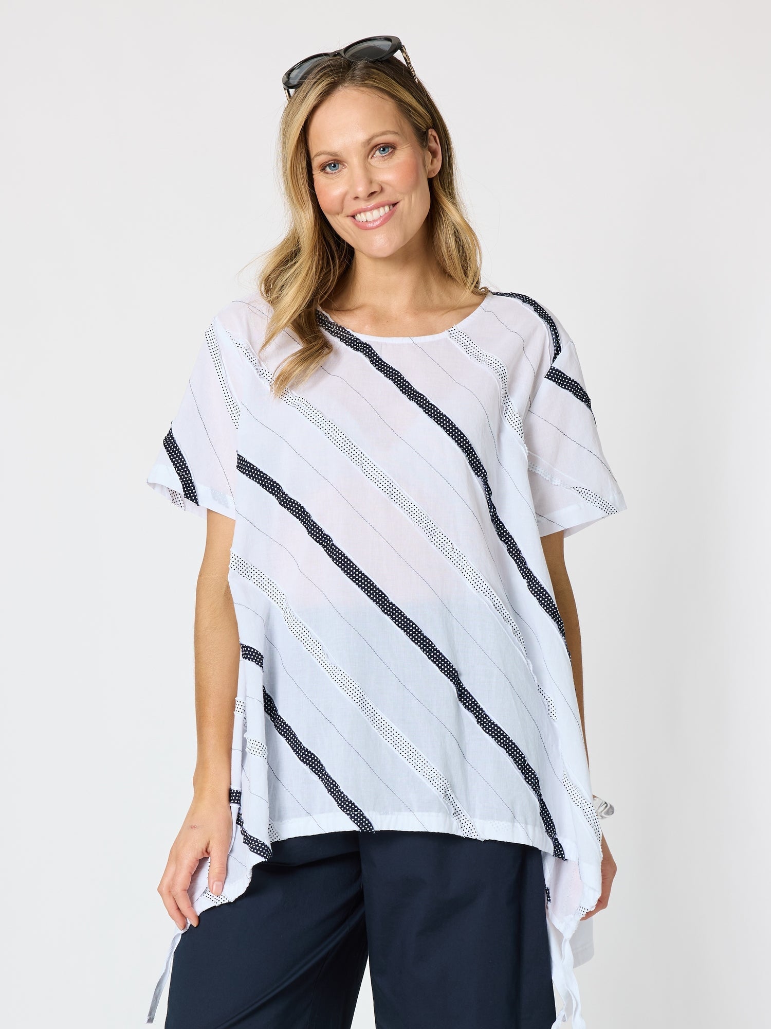 Image of a model wearing Tops. Product name - Bellevue Longline Top White in White colour by brand - Clarity