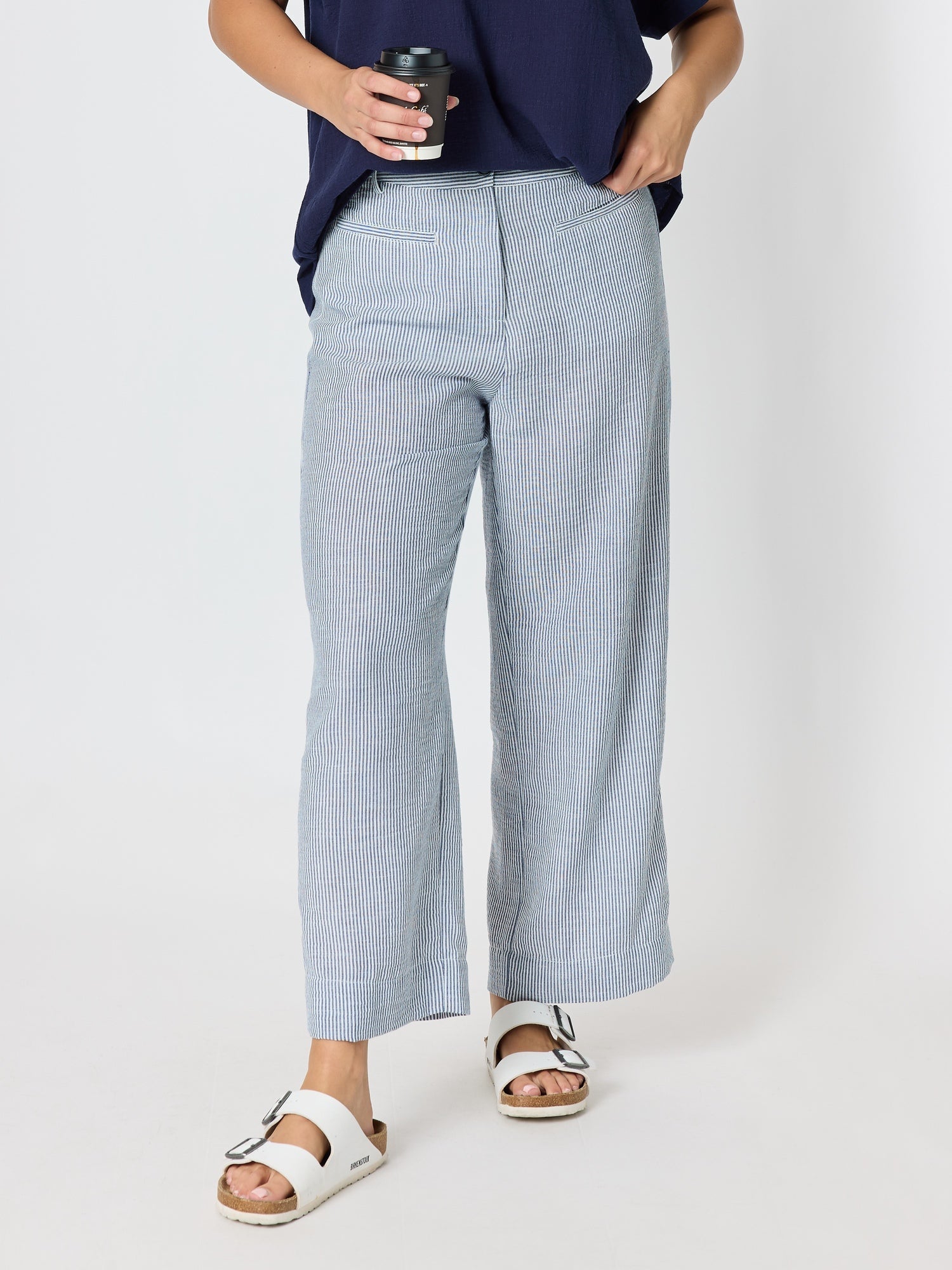 Image of a model wearing Pants. Product name - City Stripe Print Straight Leg Pant Navy/White in Navy/White colour by brand - Threadz