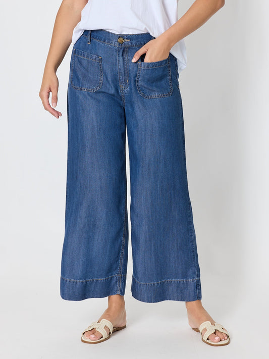 Image of a model wearing Pants. Product name - Dune Carpenter Wide Leg Cropped Pant Dark Denim in Dark Denim colour by brand - Threadz