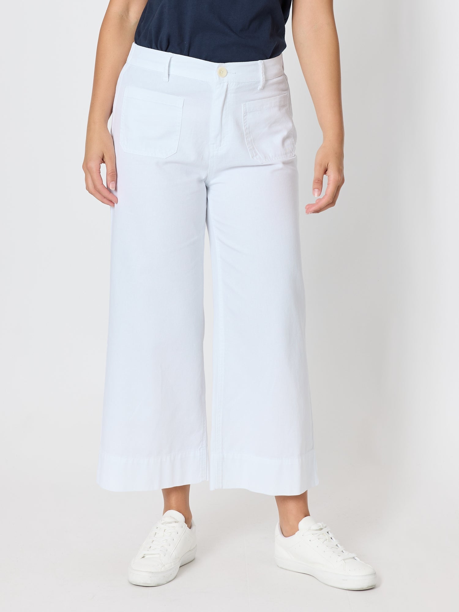 Image of a model wearing Pants. Product name - Dune Carpenter Wide Leg Cropped Pant White in White colour by brand - Threadz