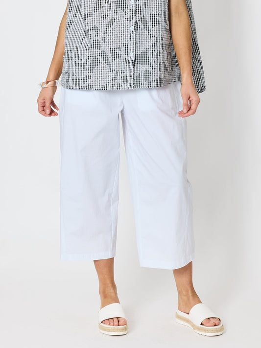 Image of a model wearing Pants. Product name - Toledo Parachute Crop Pant White in White colour by brand - Clarity