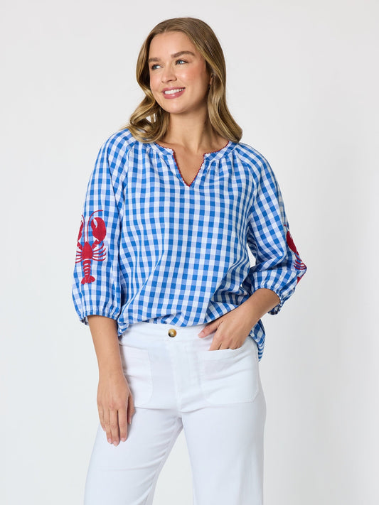 Image of a model wearing Tops. Product name - Cove Embroidered Gingham Print Top Azure White in Azure White colour by brand - Threadz