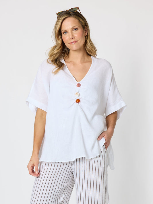Image of a model wearing Tops. Product name - Haven Breeze Linen Top White in White colour by brand - Hammock & Vine
