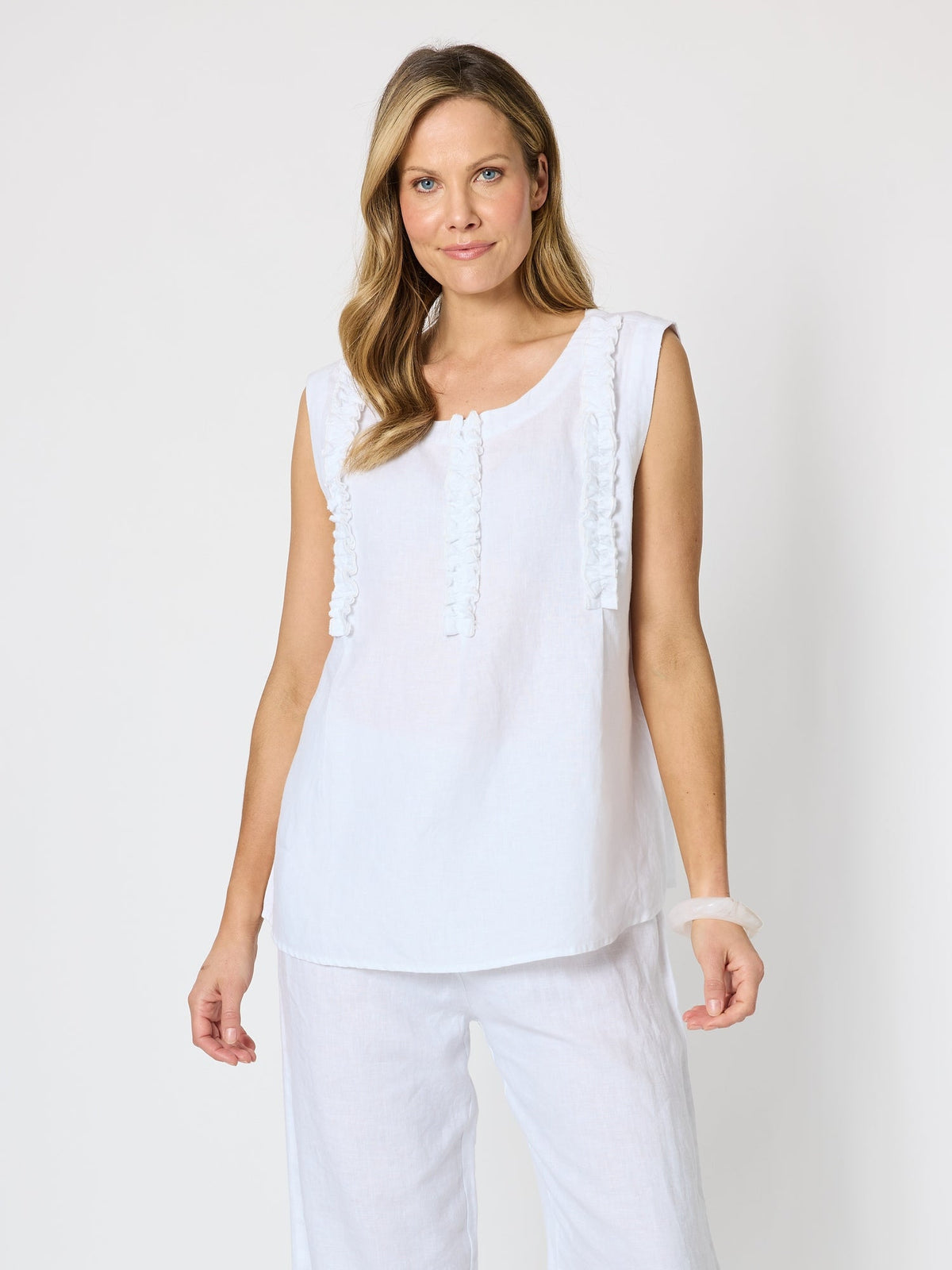 Image of a model wearing Tops. Product name - Haven Frill Cami White in White colour by brand - Hammock & Vine