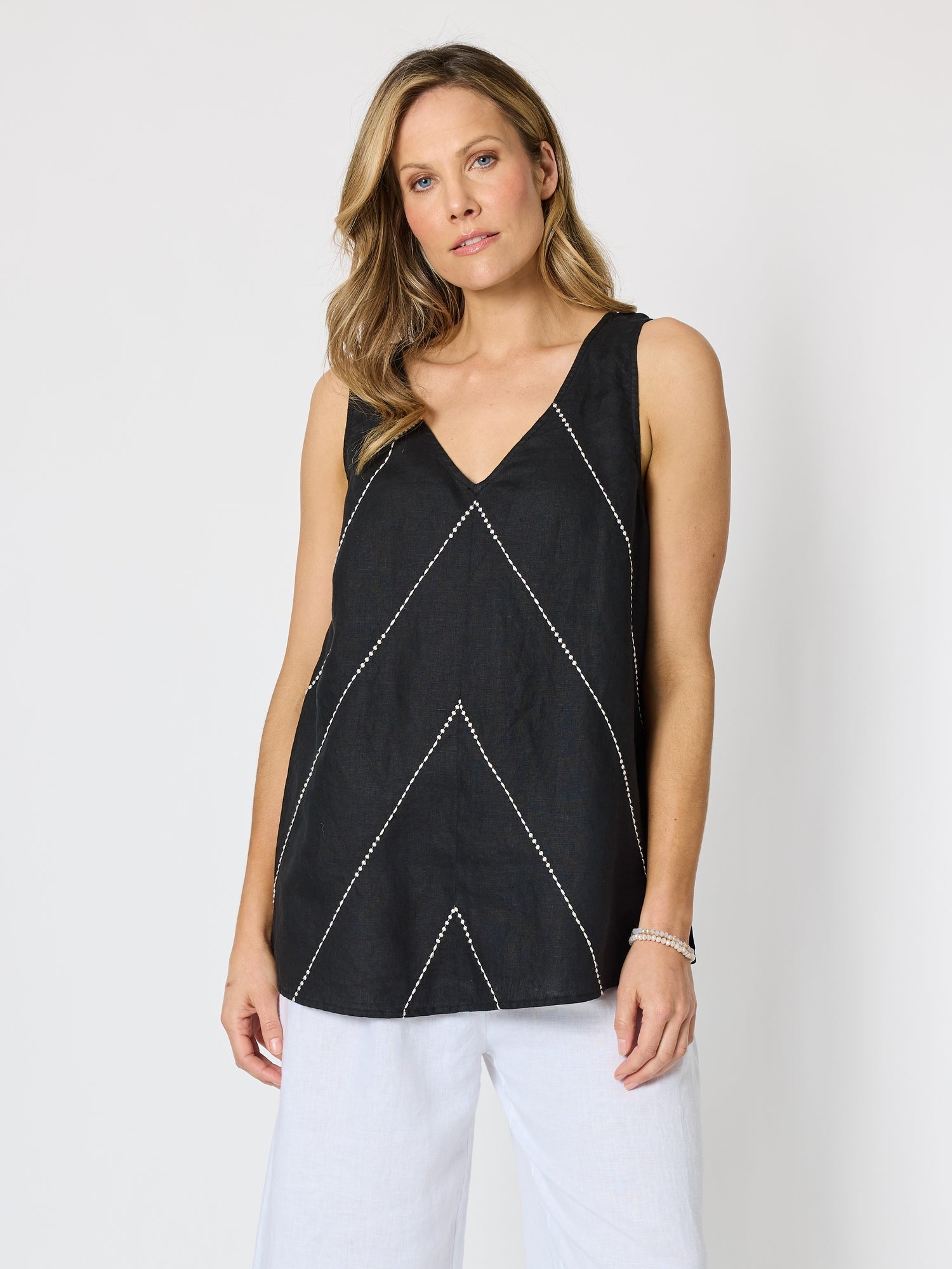 Image of a model wearing Tops. Product name - Haven Chevron Stitch Linen Cami Black/White in Black/White colour by brand - Hammock & Vine