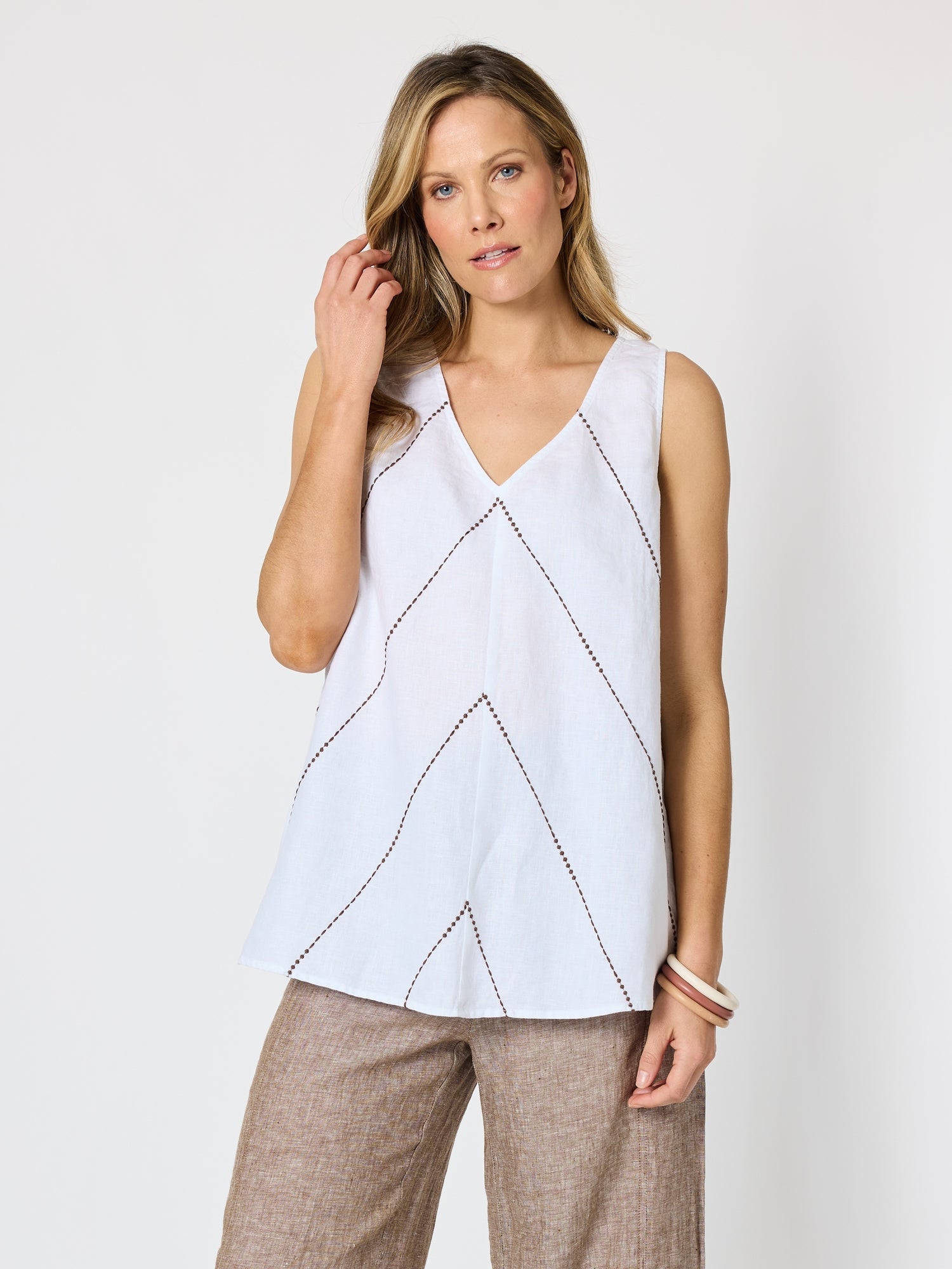Image of a model wearing Tops. Product name - Haven Chevron Stitch Linen Cami White Mocha in White Mocha colour by brand - Hammock & Vine
