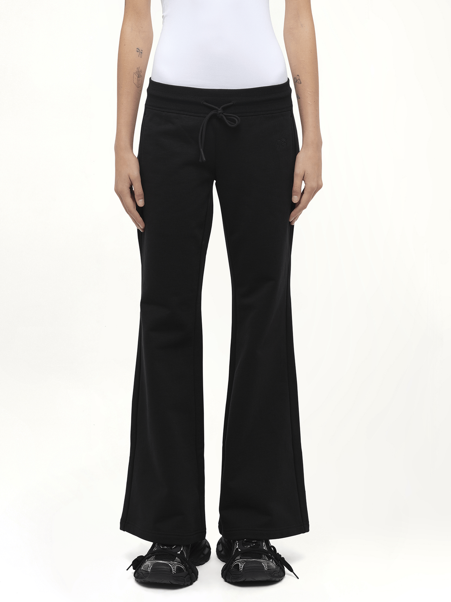 Image of a model wearing Pants. Product name - Casual Flared Sweatpants in Black colour by brand - FAX COPY EXPRESS