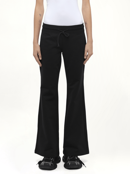 Image of a model wearing Pants. Product name - Casual Flared Sweatpants in Black colour by brand - FAX COPY EXPRESS