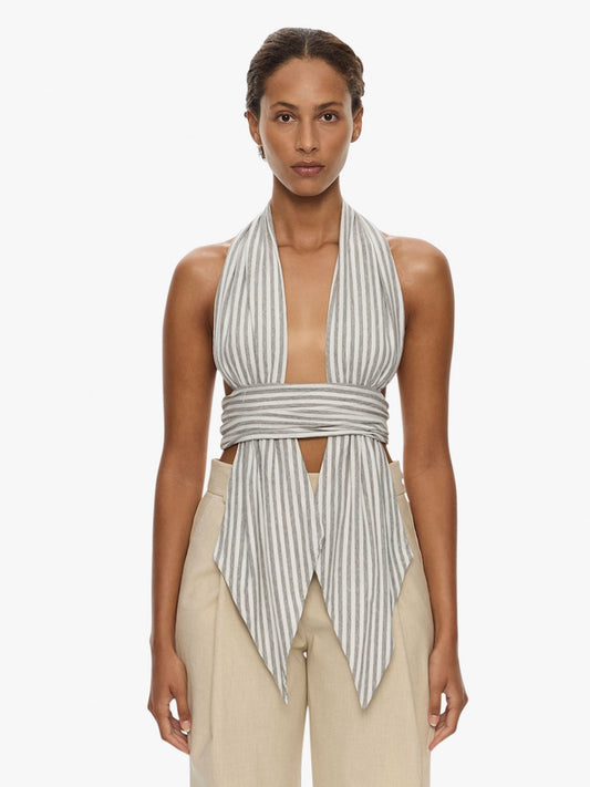 Image of a model wearing Tops. Product name - Scarf Draped Halter Top in Stripe colour by brand - CHRISTOPHER ESBER