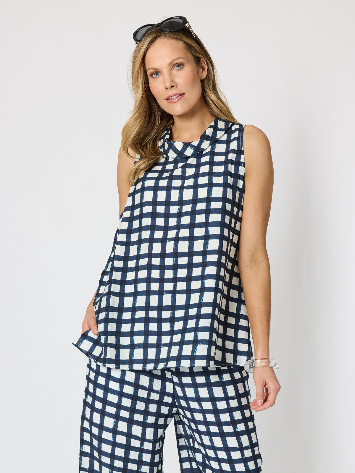 Image of a model wearing Tops. Product name - Monaco Grid Print Top Navy/White in Navy/White colour by brand - Clarity