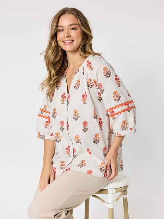 Image of a model wearing Tops. Product name - Candelabra Flower Print Top Natural Multi in Natural Multi colour by brand - Threadz