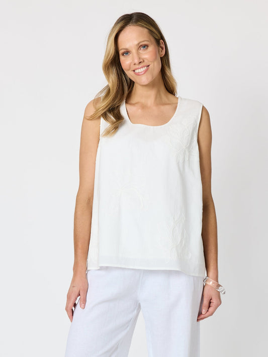 Image of a model wearing Tops. Product name - Lagoon Floral Palm Embroidered Cami Ivory in Ivory colour by brand - Threadz