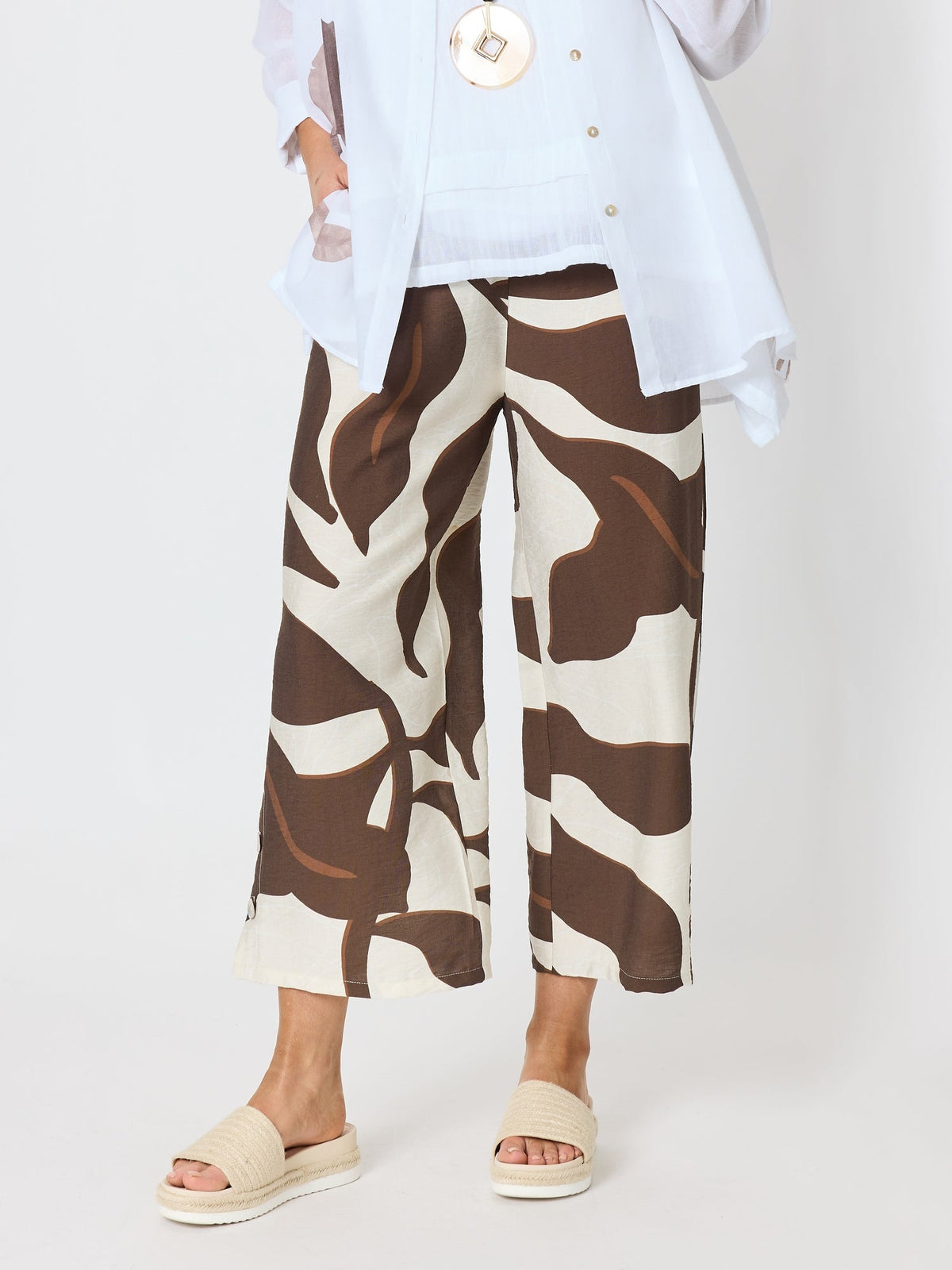 Image of a model wearing Pants. Product name - Bay Leaf Wide Leg Pant Mocha Multi in Mocha Multi colour by brand - Clarity